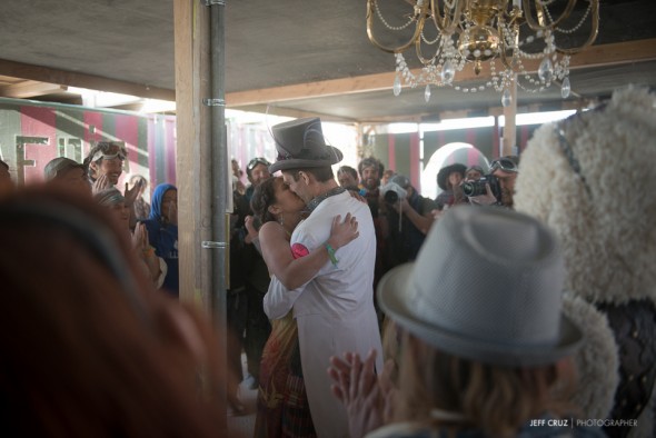 The happy couple's first kiss. Magical things happen at Burning Man.